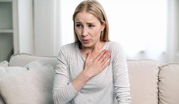 Woman with breathing difficulty due to poor indoor air quality