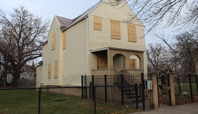 Boarded up house