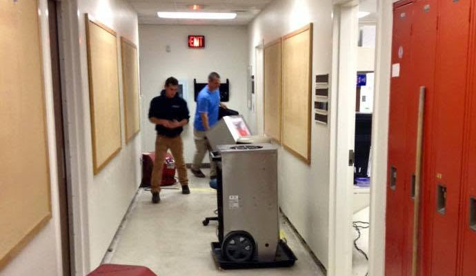 Commercial hallway with restoration equipment