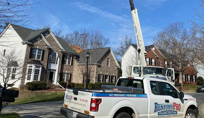 RestorePro truck at roof repair job
