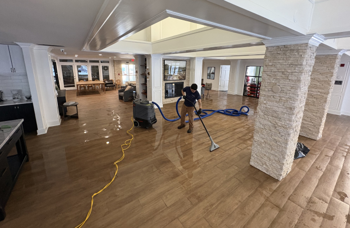 Expert providing water damage restoration service in commercial space