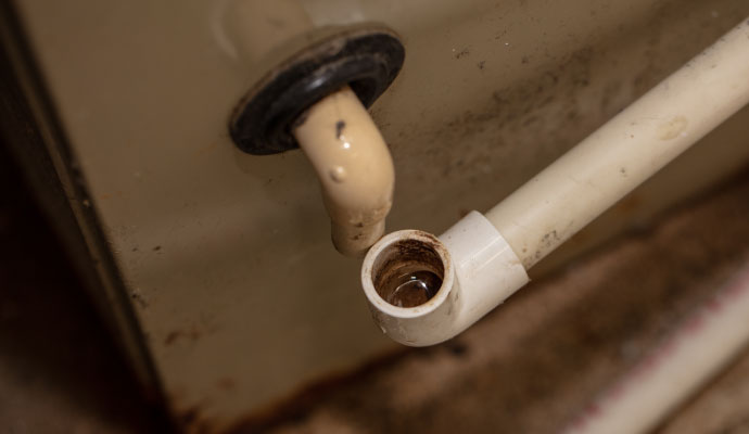 Disconnected PVC A/C unit condensate drain pipe