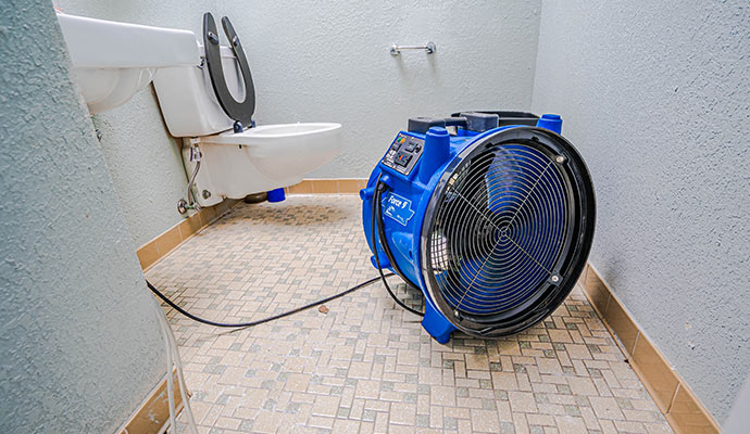 Drying water damaged toilet floor