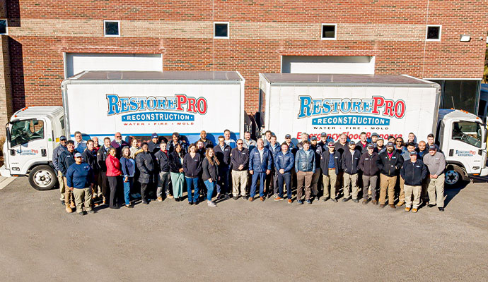 RestorePro team with service trucks