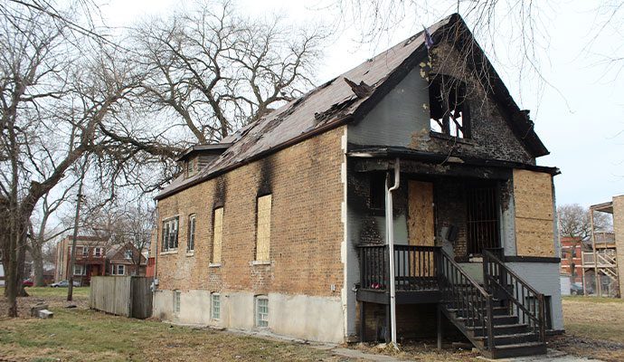 A fire damaged barded-up house