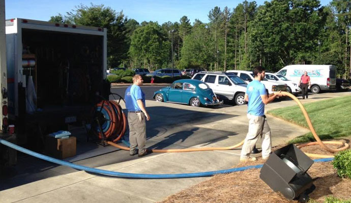 Restoration technicians with extraction truck