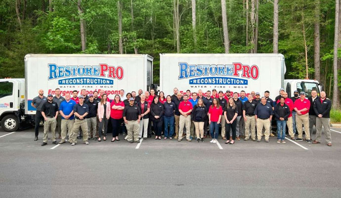 RestorePro Reconstruction team with service vehicle