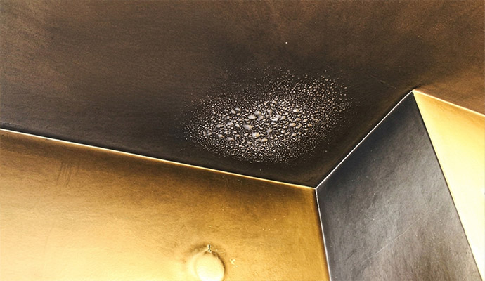 Smoke and soot damage on ceiling corner