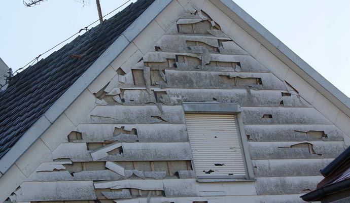 Severely hail damaged house