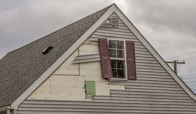 Wind damaged house siding