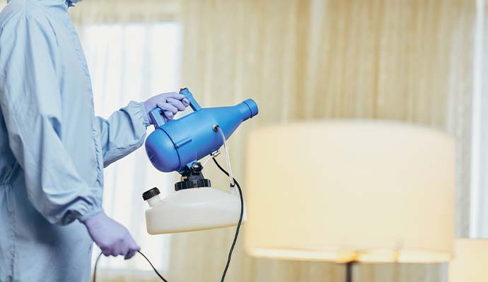 Technician performing smoke deodorizing service