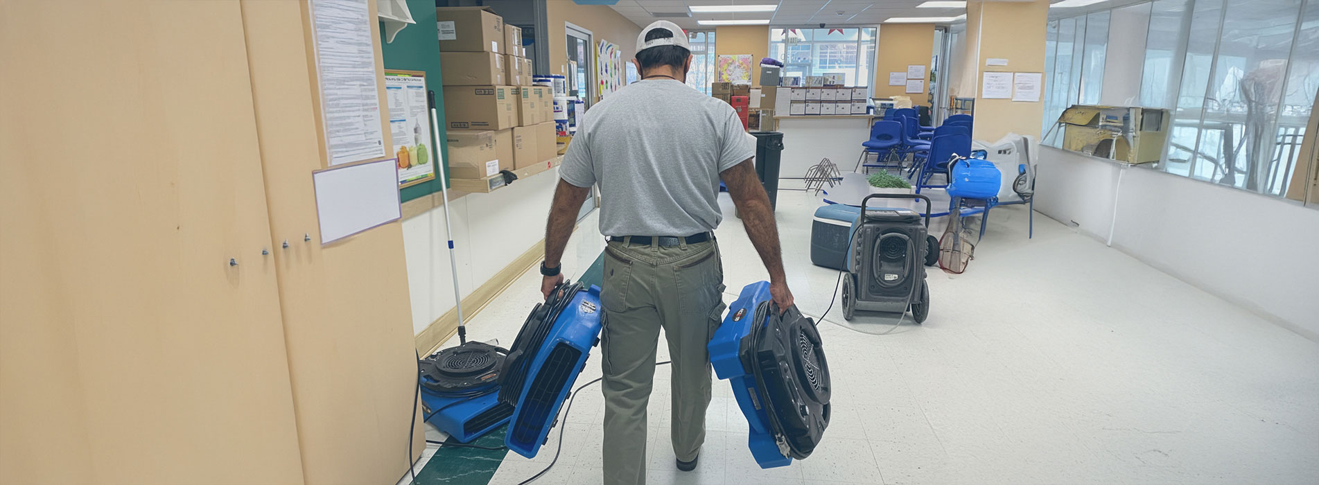 Water damage cleanup team in a commercial building