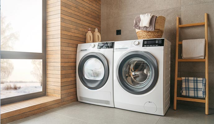 Couple of washing machines inside laundry room