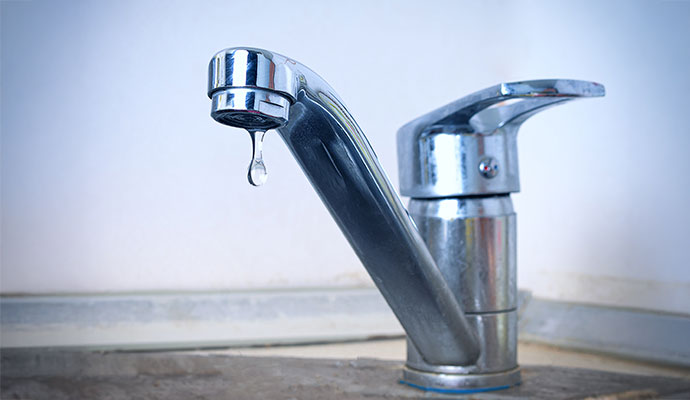 Leaky faucet dripping water