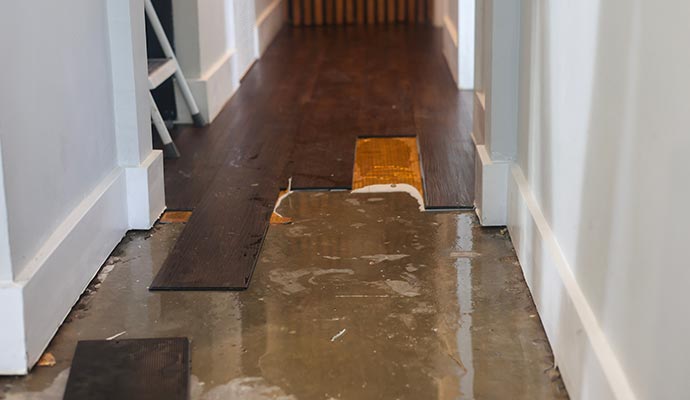 Severely damaged wooden floor due to water