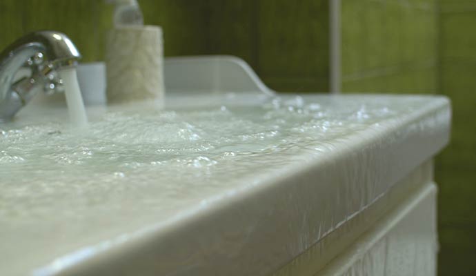 Water overflowing from bathroom sink