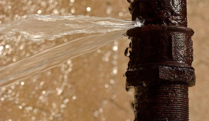 Water spraying from a burst pipe